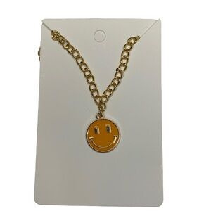 Gold smiley face necklace